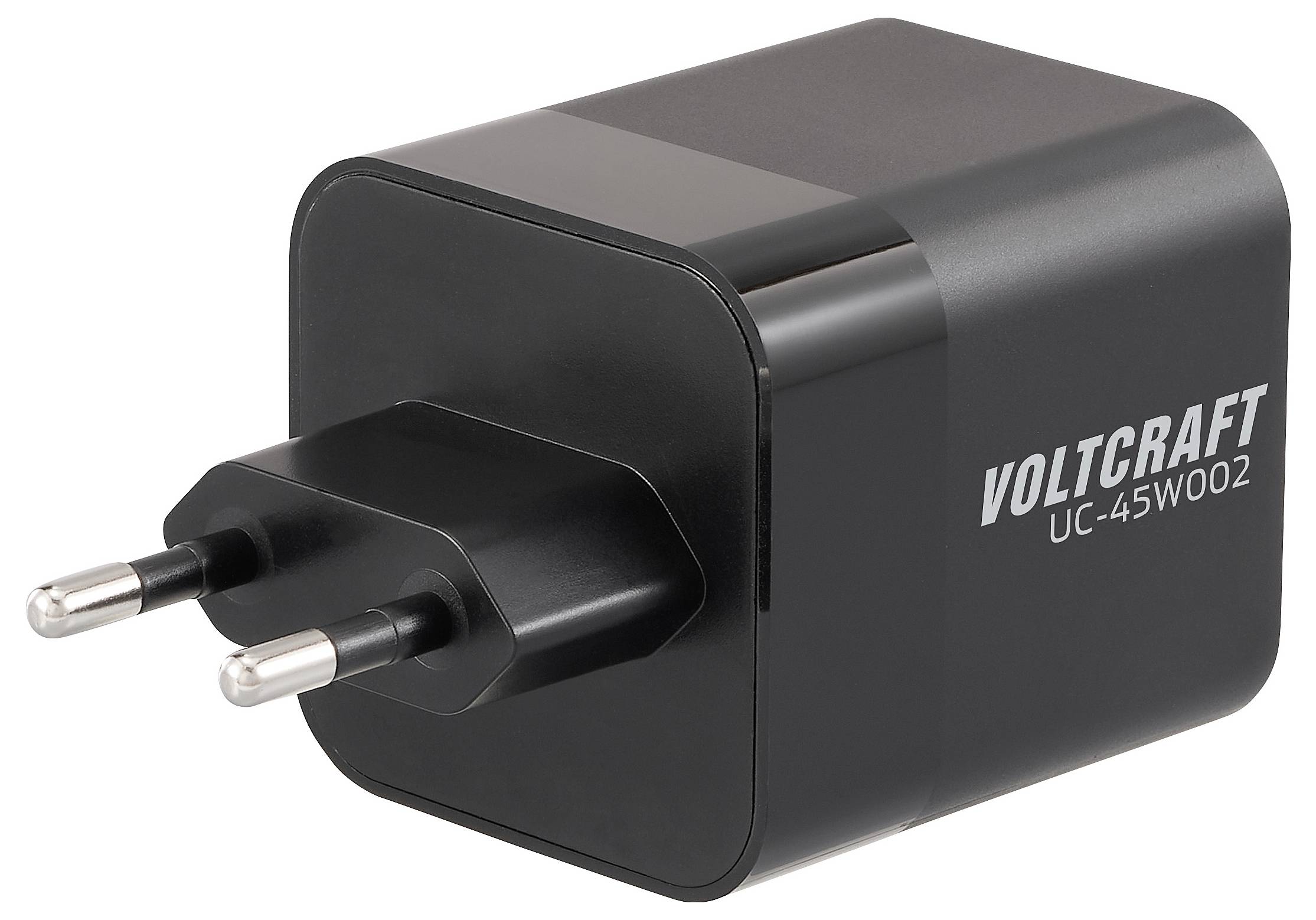 A black Voltcraft UC-45W002 power adapter with two prongs designed for EU outlets, used for charging electronic devices.