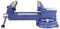 A blue metal bench vise with a rotating base and adjustable jaws, used to hold objects securely in place for work.