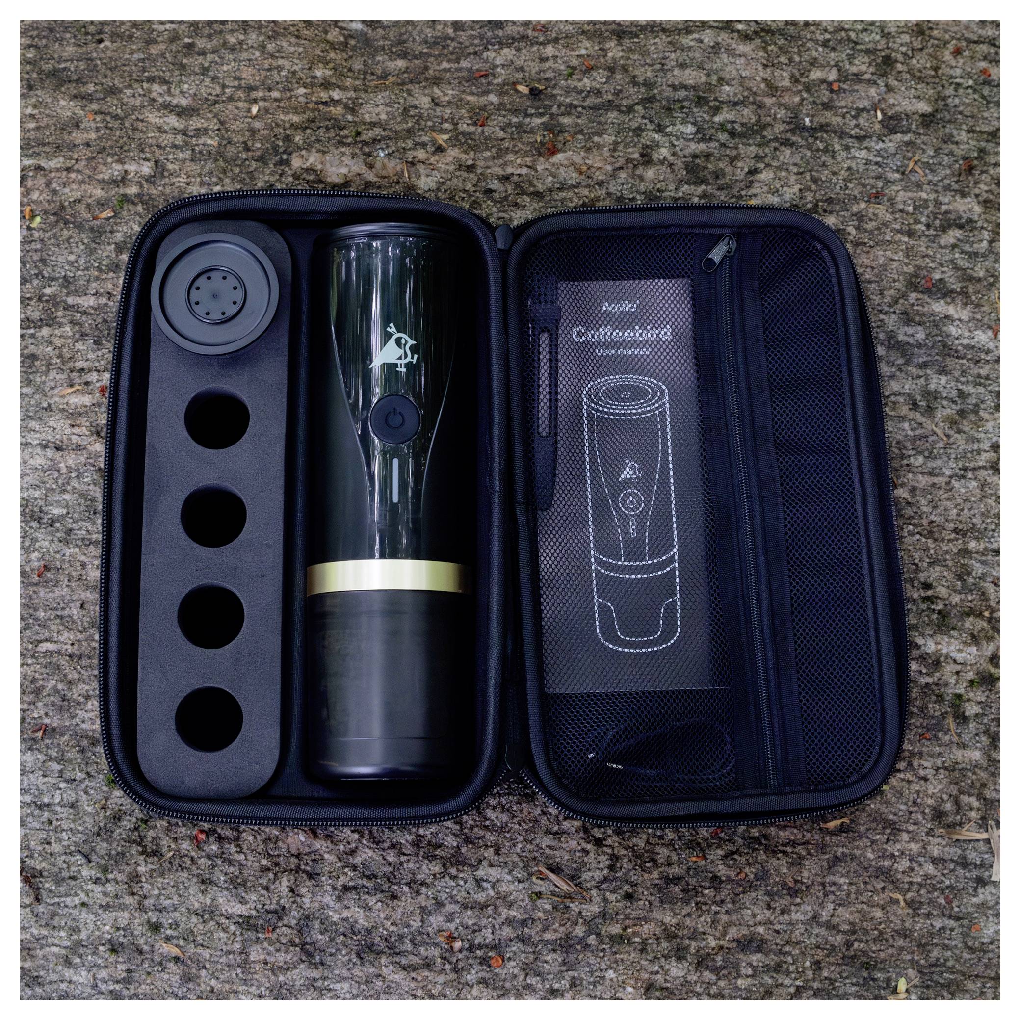 Portable coffee grinder kit in a zippered case with four slots, a grinder, and a mesh pouch containing an instruction manual.