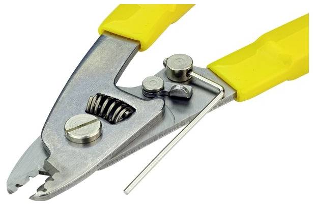 'Close-up of a yellow-handled wire stripper with a metal adjustment component, used for cutting and stripping electrical wires.'