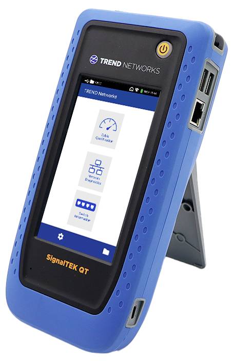 Handheld blue device displaying a screen with icons for 'Data Quality', 'Reports', and 'Cable Information'. The device, branded 'Trend Networks', stands on a kickstand.