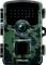 A camouflaged wildlife camera with a large lens and infrared LEDs, designed for outdoor use in capturing images of animals in their natural habitat.