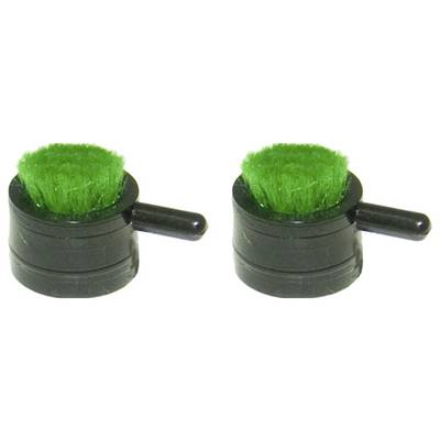 Two small black objects with green bristles and side handles, resembling mini scrubbers, positioned side by side on a white background.