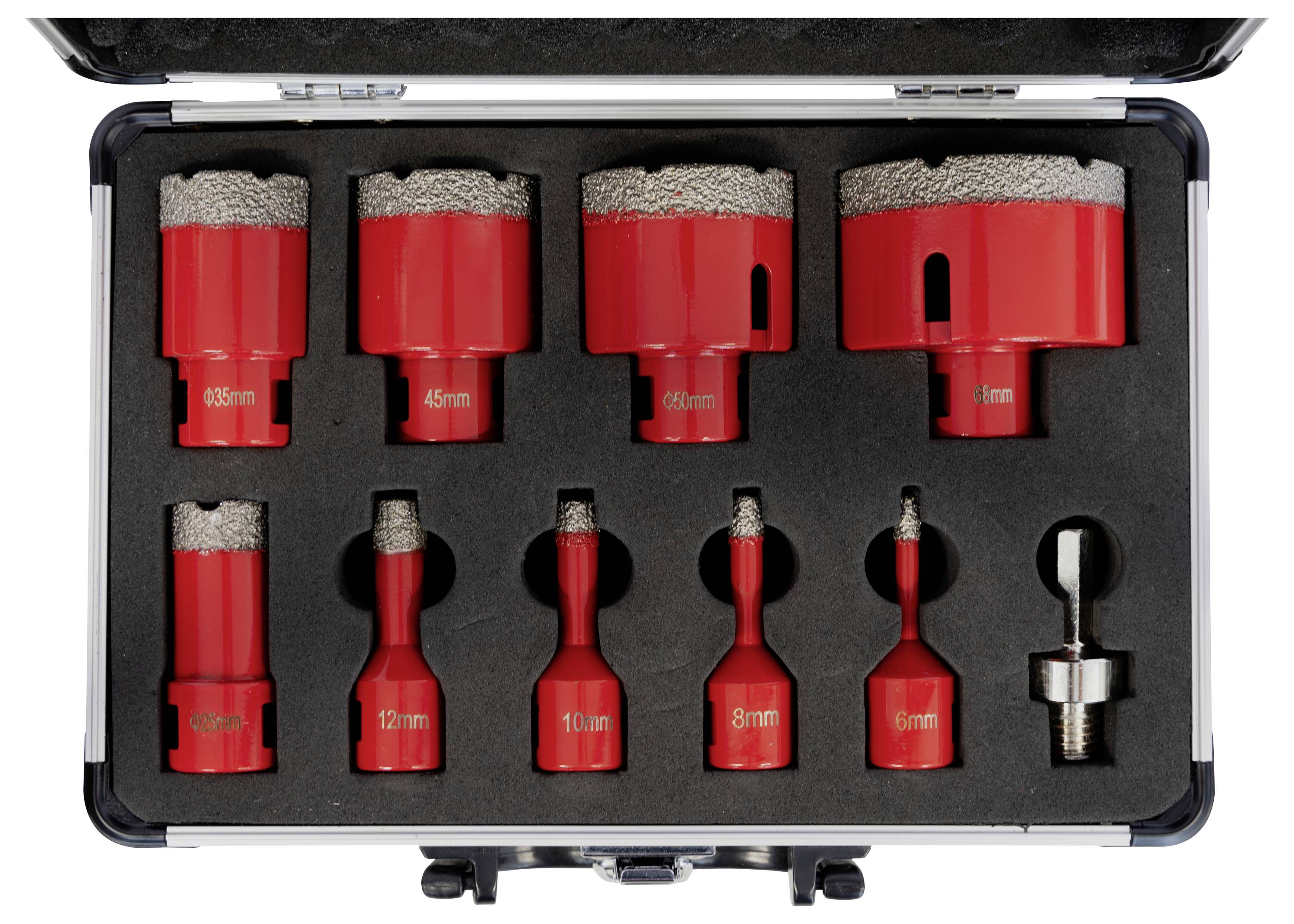 A box containing nine red diamond drill bits of various sizes and a bit holder inside a black foam case.