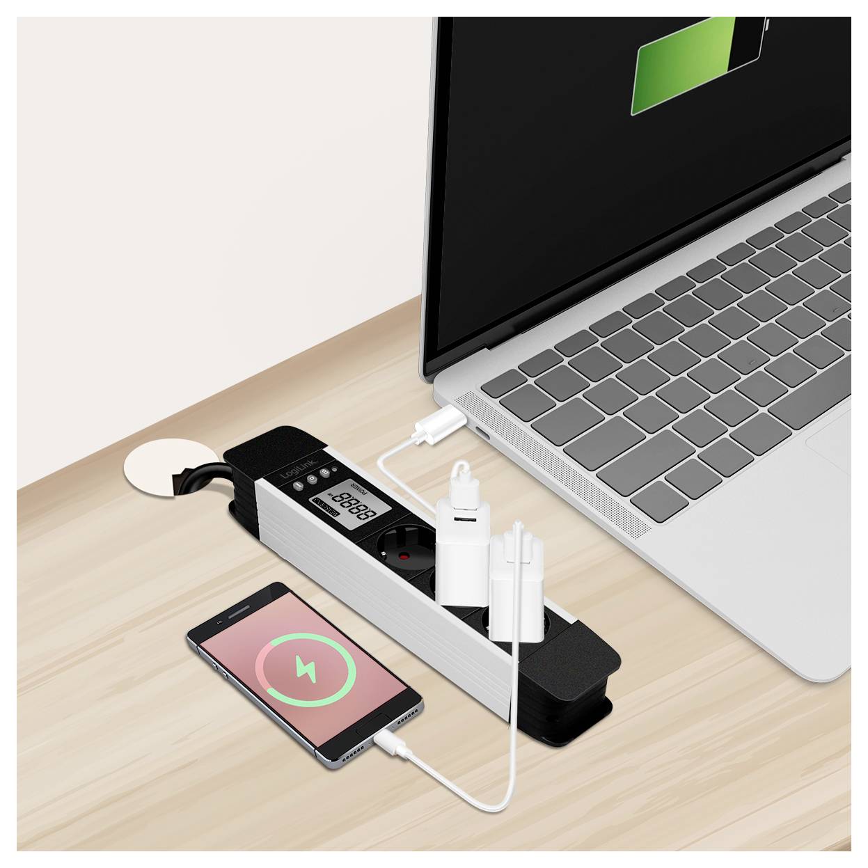 A laptop, smartphone, and camera are connected to a multi-port charging station on a desk, indicating simultaneous device charging.