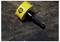 'A C.K. brand yellow hole saw drill bit lies on a dark wooden surface, featuring a jagged edge for cutting circular holes.'