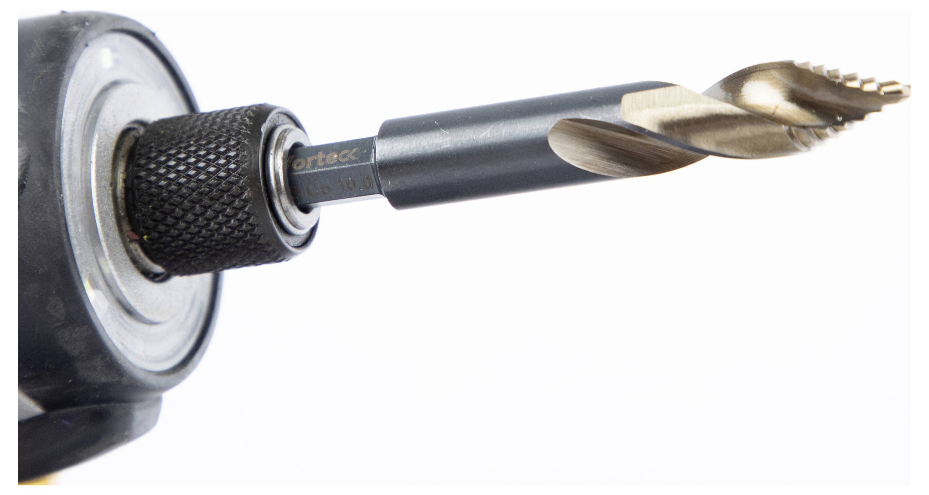 A close-up of a drill bit attached to an electric drill, focusing on the metal spiral tip designed for cutting into materials.