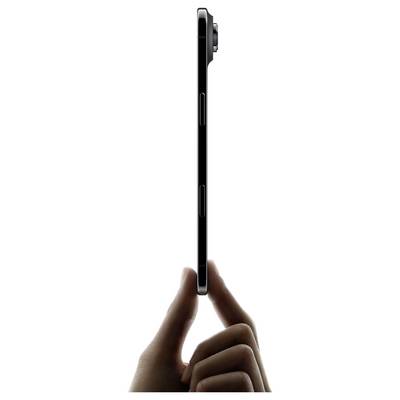 The image shows a person's hand holding a thin smartphone vertically, emphasizing the device's slim profile and side buttons.