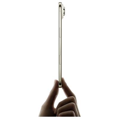 A hand holds a sleek, thin smartphone vertically, showcasing its slim profile and side buttons.
