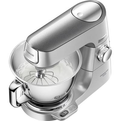 A sleek metallic kitchen mixer with a large bowl and whisk attachment. Display shows '15:35'. Mixer set on a clean, white surface.