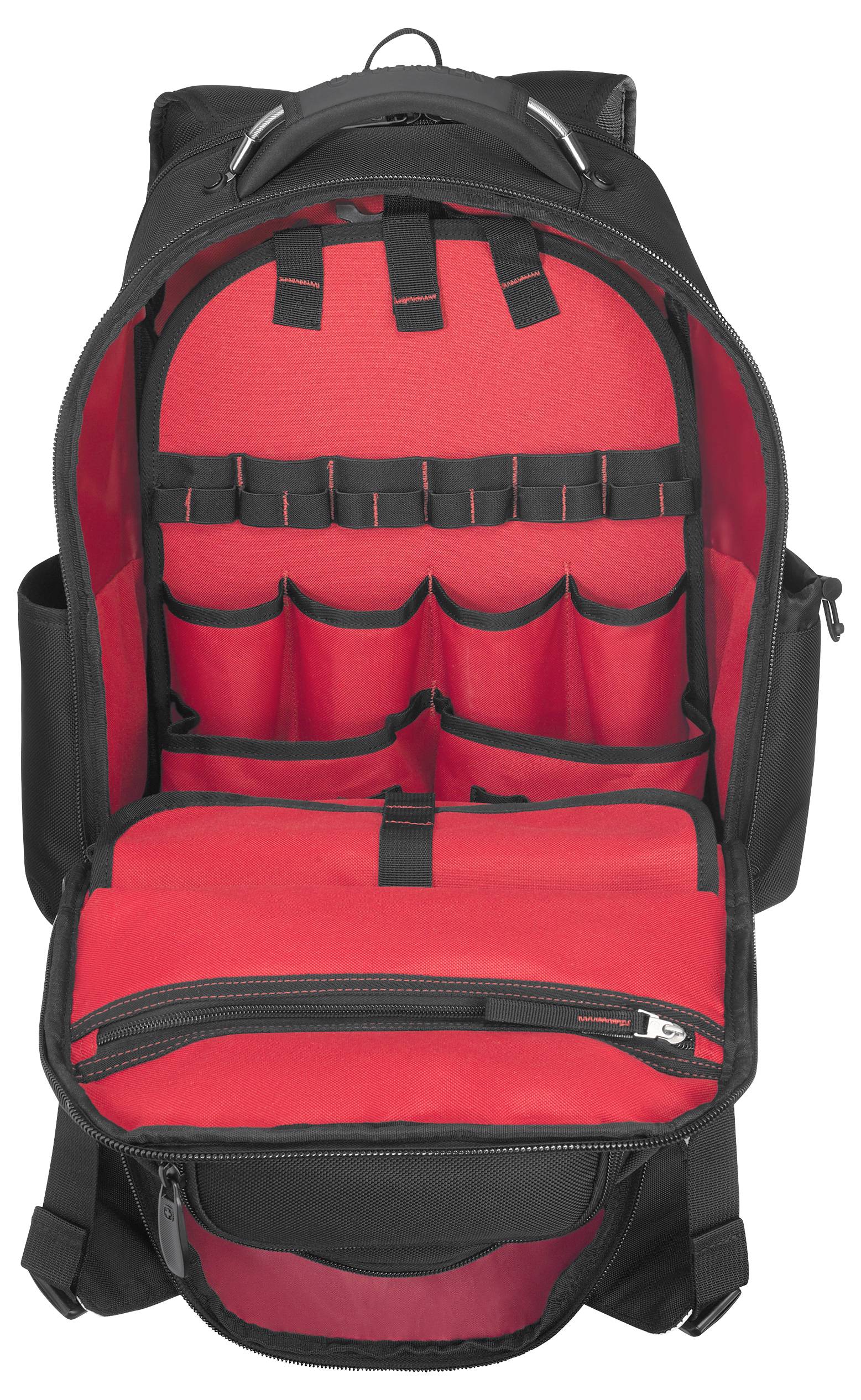 Open black backpack with red interior, showing multiple organized compartments and pockets for storage and organization.