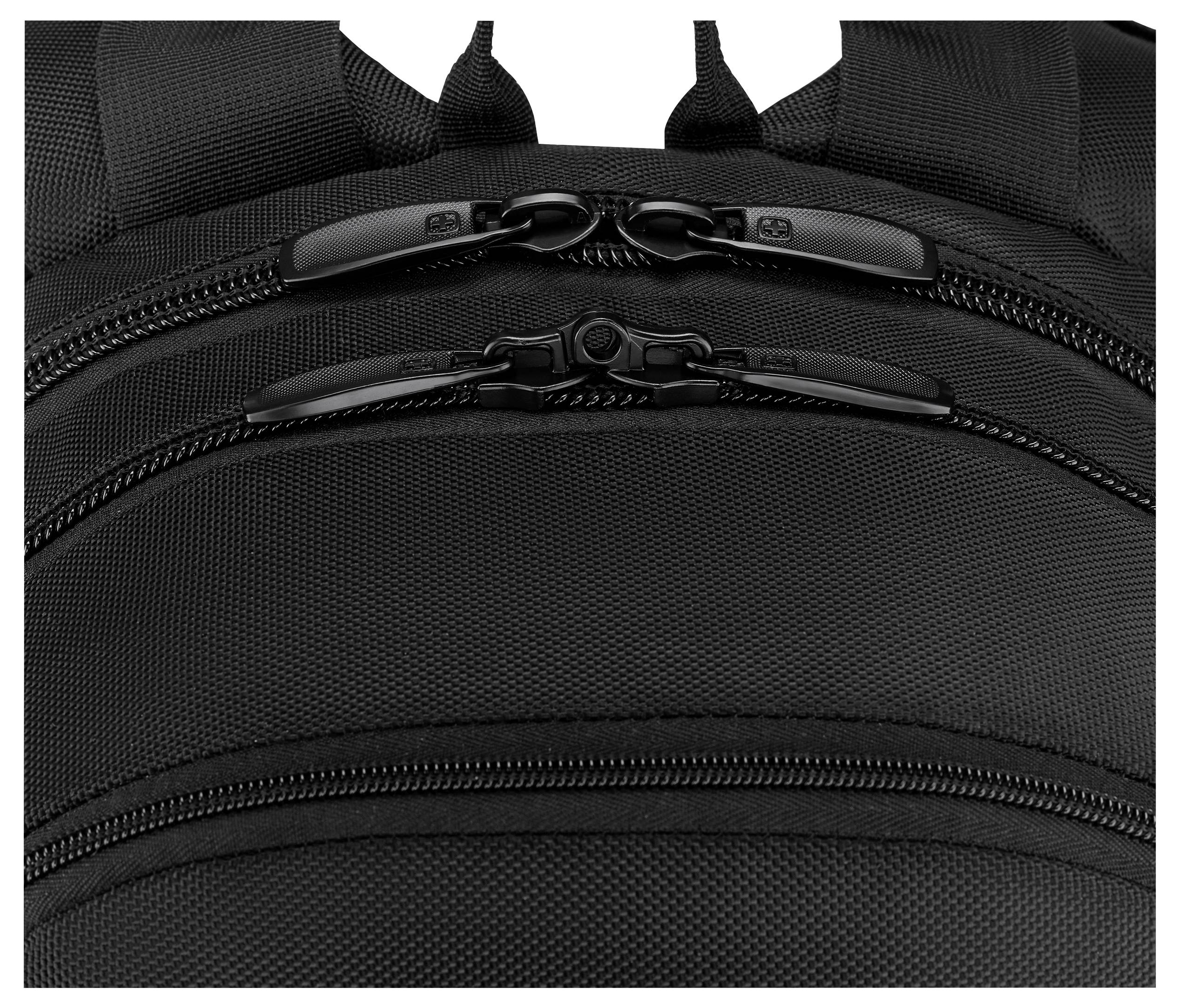 The image shows a close-up of a black backpack, focusing on its multiple zippered compartments, highlighting its storage features.