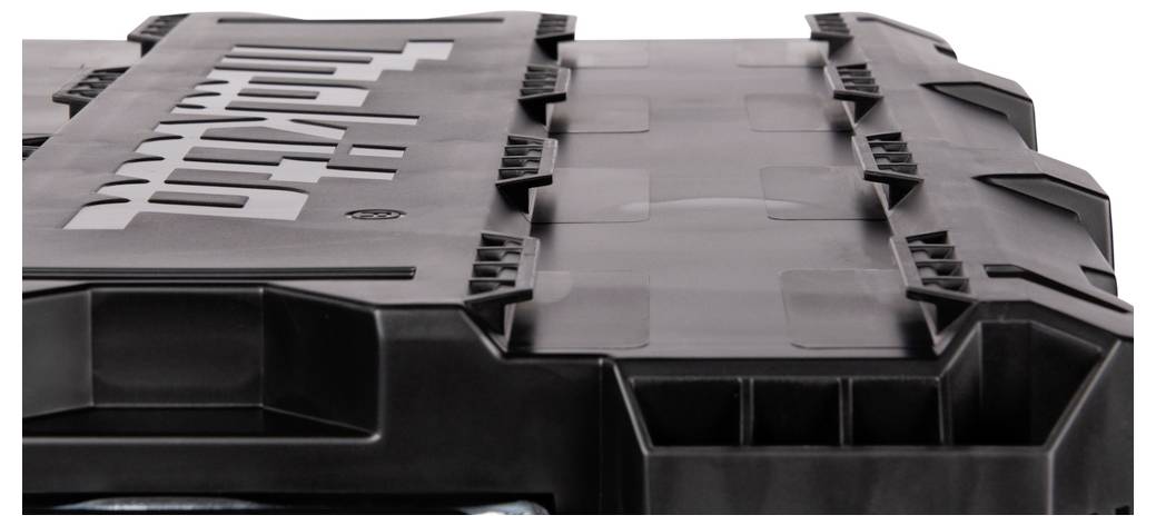 A black, rugged storage case with a textured surface and an embossed logo on the lid, designed for secure and durable tool storage.