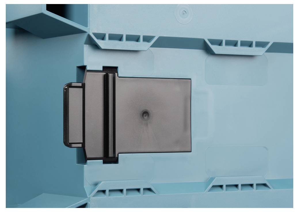 'A close-up of a teal plastic box with a black latch mechanism in the center, used for securing the lid.'