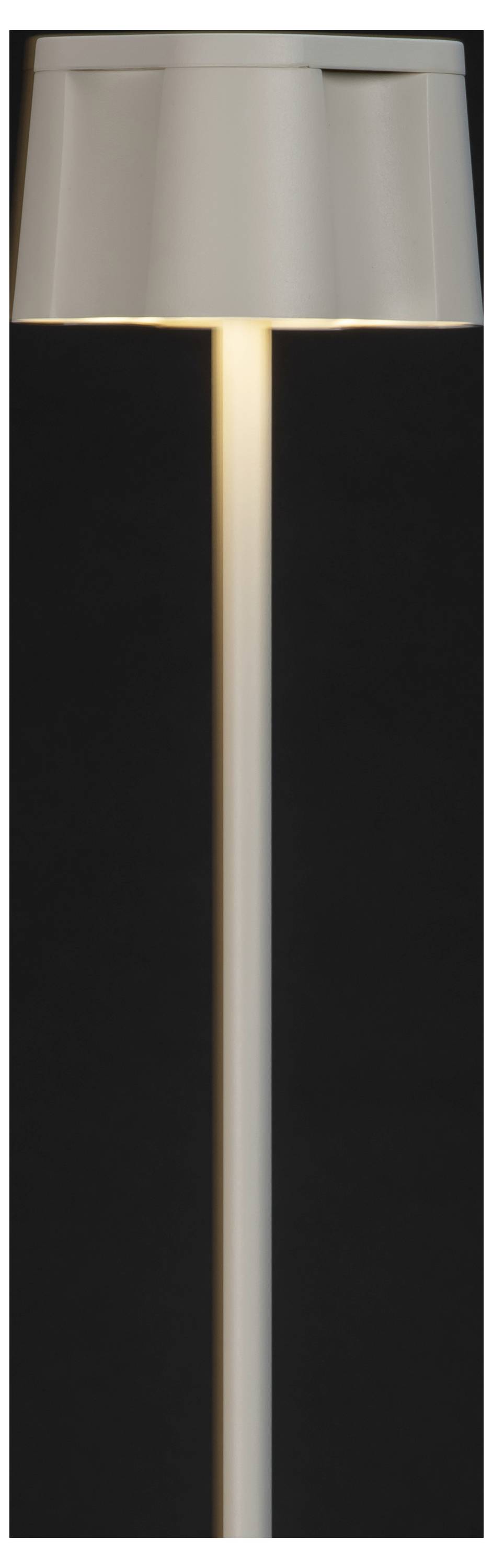 'A modern minimalist floor lamp with a cylindrical shade, glowing softly against a dark background.'