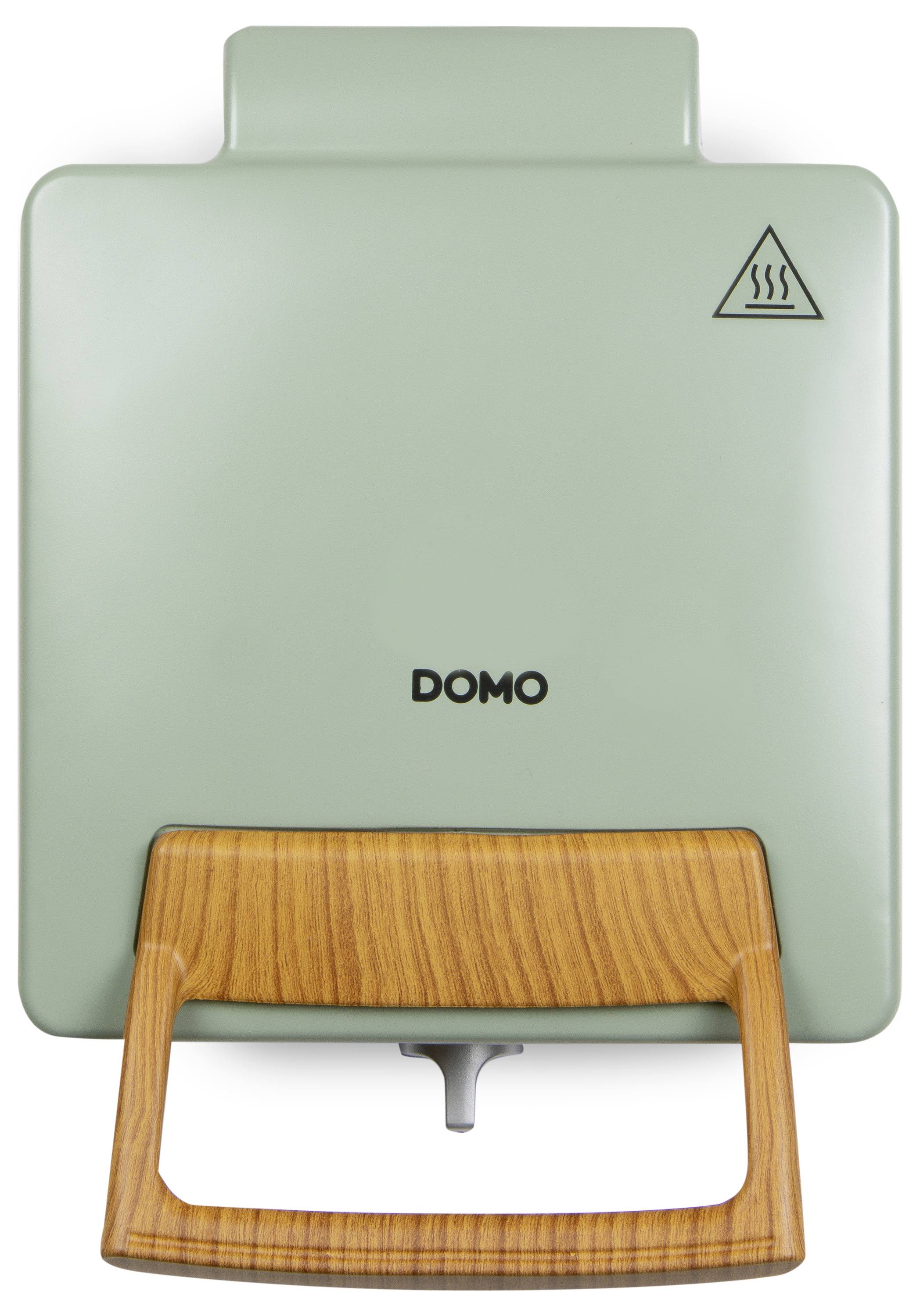 A green sandwich maker with a wooden handle, labeled 'Domo', featuring a steam warning symbol on the top lid.