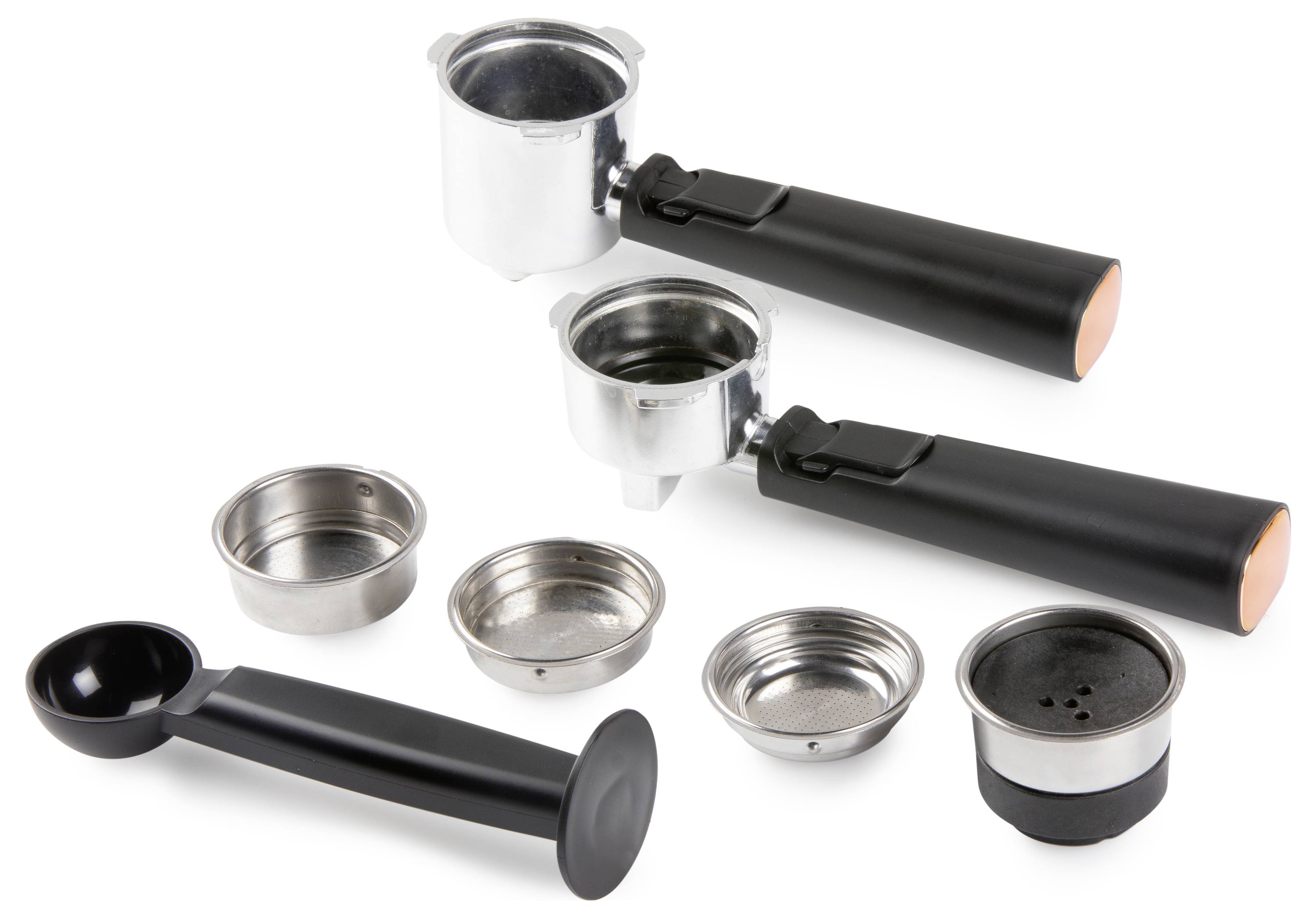 Two portafilters with black handles and five coffee filter baskets arranged in front, showcasing espresso machine components.