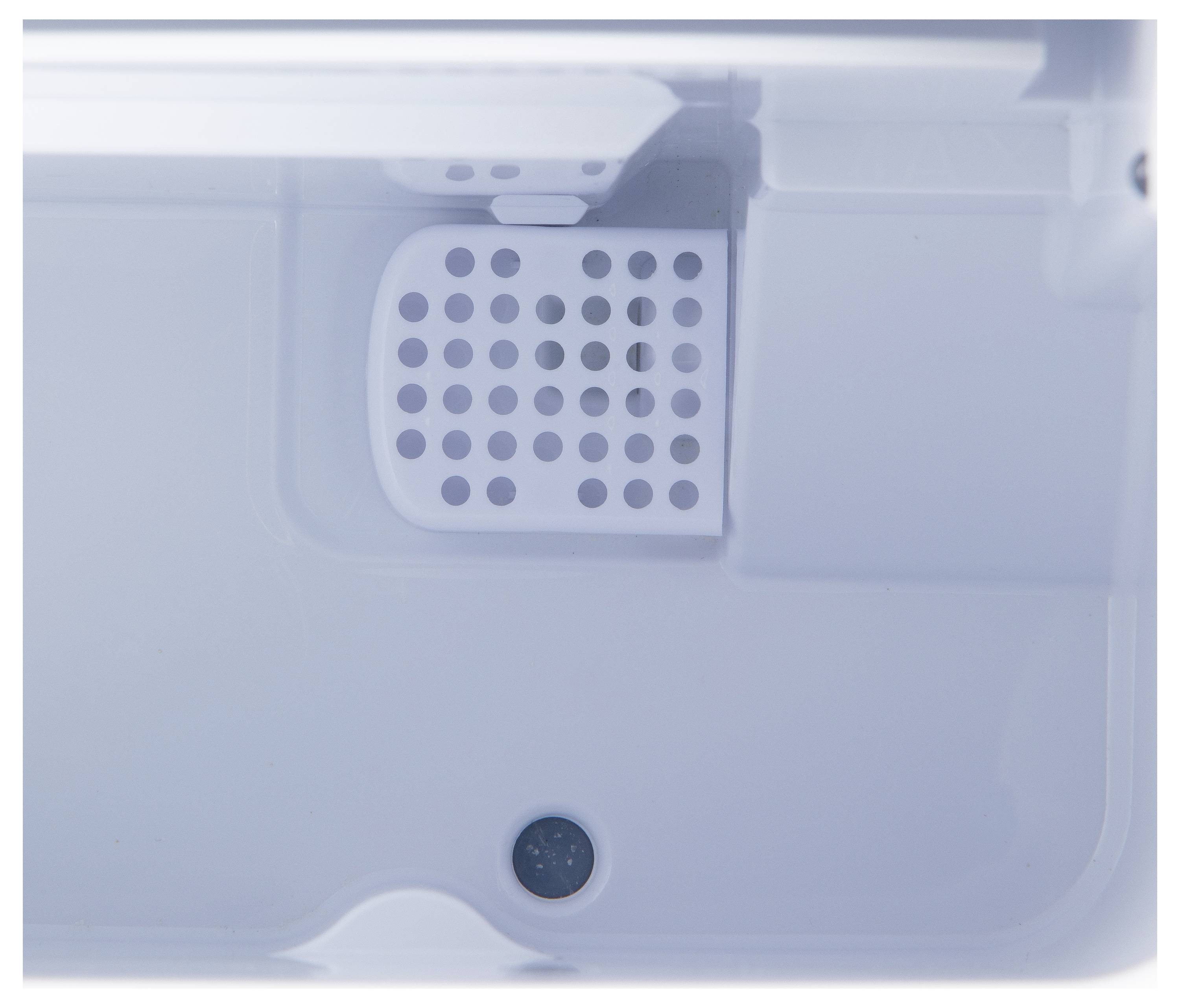 A white plastic ice maker bin with a perforated cover and drainage hole visible.