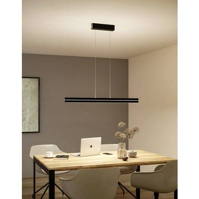 A modern dining room with a wooden table, a laptop, two white chairs, and a sleek black pendant light hanging above.