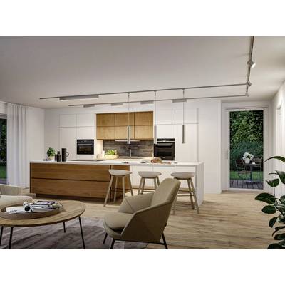 Modern kitchen with wooden island, white cabinets, and built-in appliances. Stools at island counter. Glass door opens to patio.