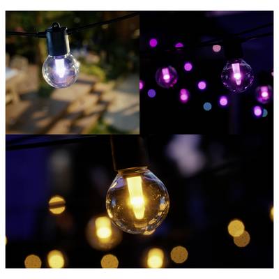 Outdoor string lights glowing in various colors, creating a cozy atmosphere at dusk. Blurred warm bokeh lights in the background.