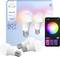 Philips Hue Essential smart bulbs with E27 base, shown with smartphone app interface for color control and brightness adjustment.