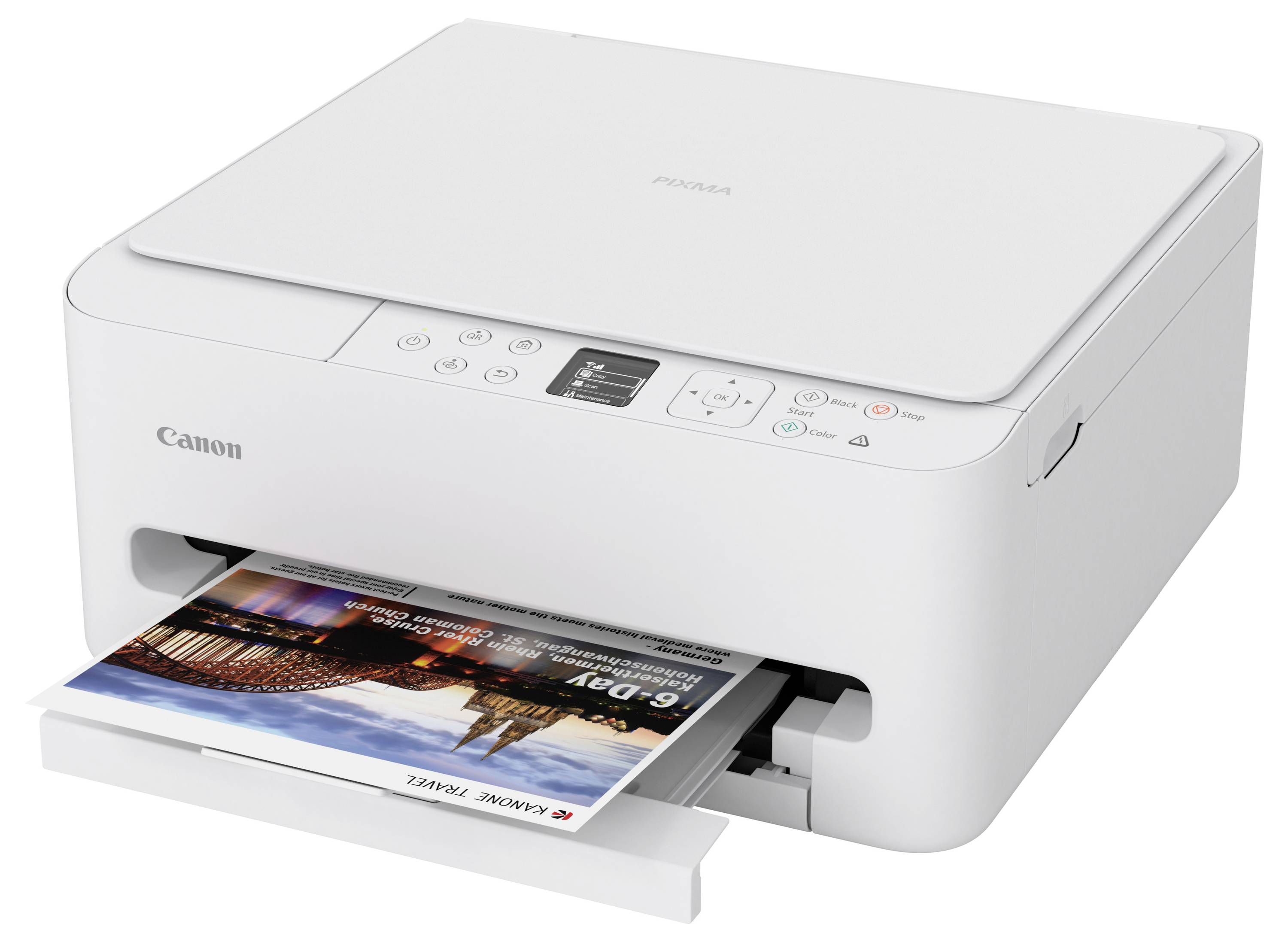 A Canon printer prints a color photo. The device is white with multiple control buttons and a display screen on the top panel.