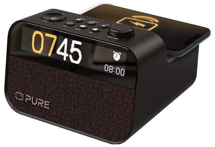 A digital alarm clock displaying '07:45' with a wireless charging pad on top, featuring a modern design and buttons for setting alarms.