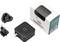 Black square wall charger with interchangeable plug adapters and retail packaging shown on a white background.