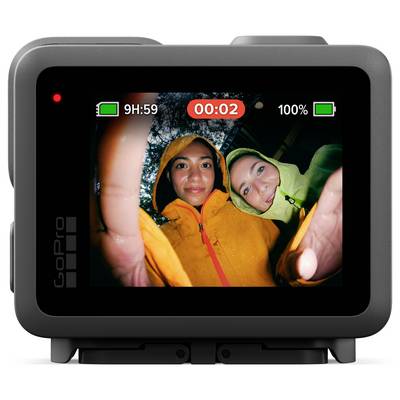 Two people in colorful rain jackets smile at the camera under a rainy sky, seen through a GoPro screen displaying a recording interface.