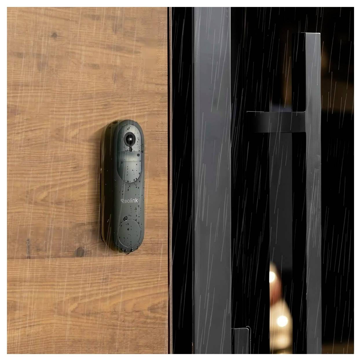 A weatherproof security camera mounted on a wooden wall outside, showing its durability and capability to function in rain conditions.