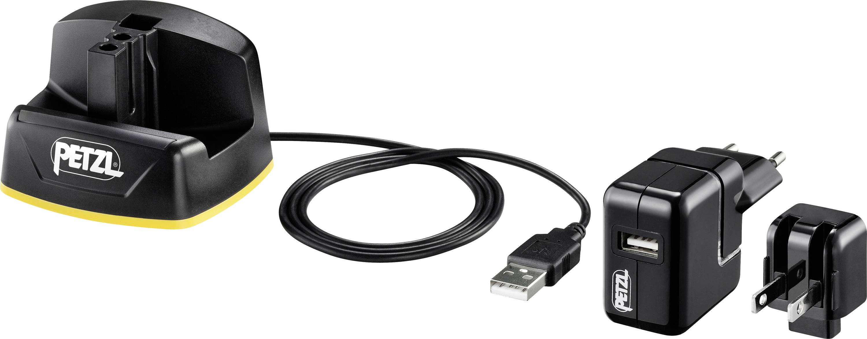 Petzl headlamp charging dock with USB cable and interchangeable plug adapters, suitable for various outlet types.