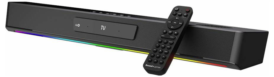 A black soundbar with rainbow light underneath, accompanied by a remote control. The soundbar displays '0' and 'TU' on the screen.