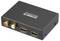 A compact black audio converter with 'Speaka PROFESSIONAL' branding. It features two HDMI outputs labeled 'OUTPUT 1' and 'OUTPUT 2,' and RCA connectors labeled 'R' and 'L.'