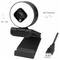A webcam with a round lens, 90° tilt and 360° rotation features, mounted on a stand with a USB cable for connectivity.