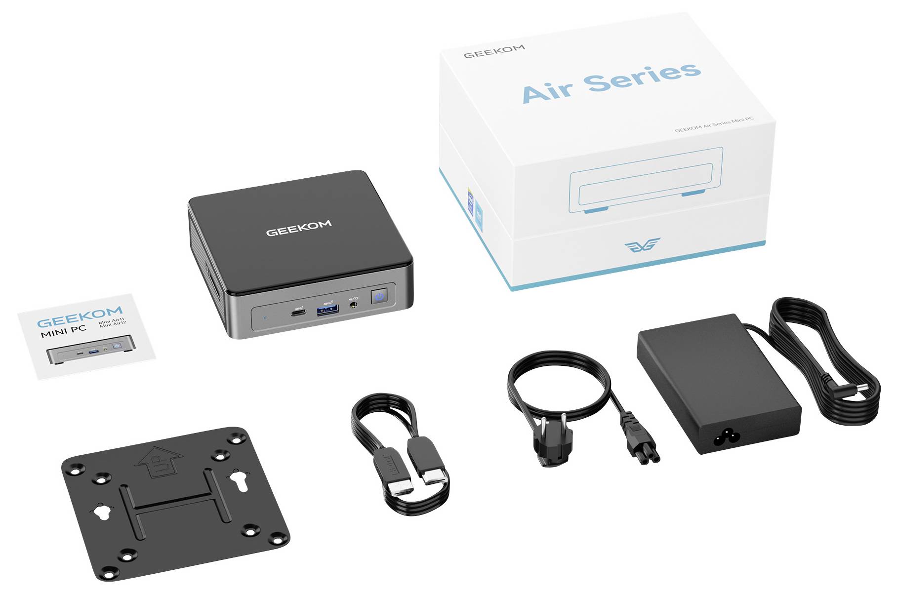 Product kit for a GEEKOM Mini PC, showing the compact computer, 'Air Series' box, power adapter, mounting plate, cable, and strap accessories.<br>