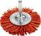 An orange abrasive wire wheel with a metal shaft, used for cleaning or grinding surfaces.