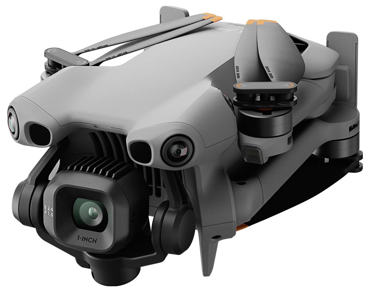 A compact, gray quadcopter drone with a camera mounted on the front, showing folded arms and propellers, ready for transport.