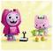 Two colorful block figures: a tall pink one with cat-like features and a smaller pink fairy figure holding a watering can, with flowers nearby.