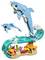 Two dolphins made of building blocks leap above colorful coral and sea plants, creating a lively ocean scene.