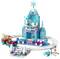 Elsa in a LEGO ice castle with snowflake details, a balcony, and accessories; Anna and Olaf are nearby, surrounded by snow-themed décor.