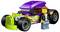 A LEGO toy: a purple and green hot rod car with flame patterns. A LEGO figure with a black jacket and jeans stands next to the car.