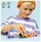 A child wearing a striped shirt and orange beanie plays with a small toy construction vehicle. Text: '5+', '61'.