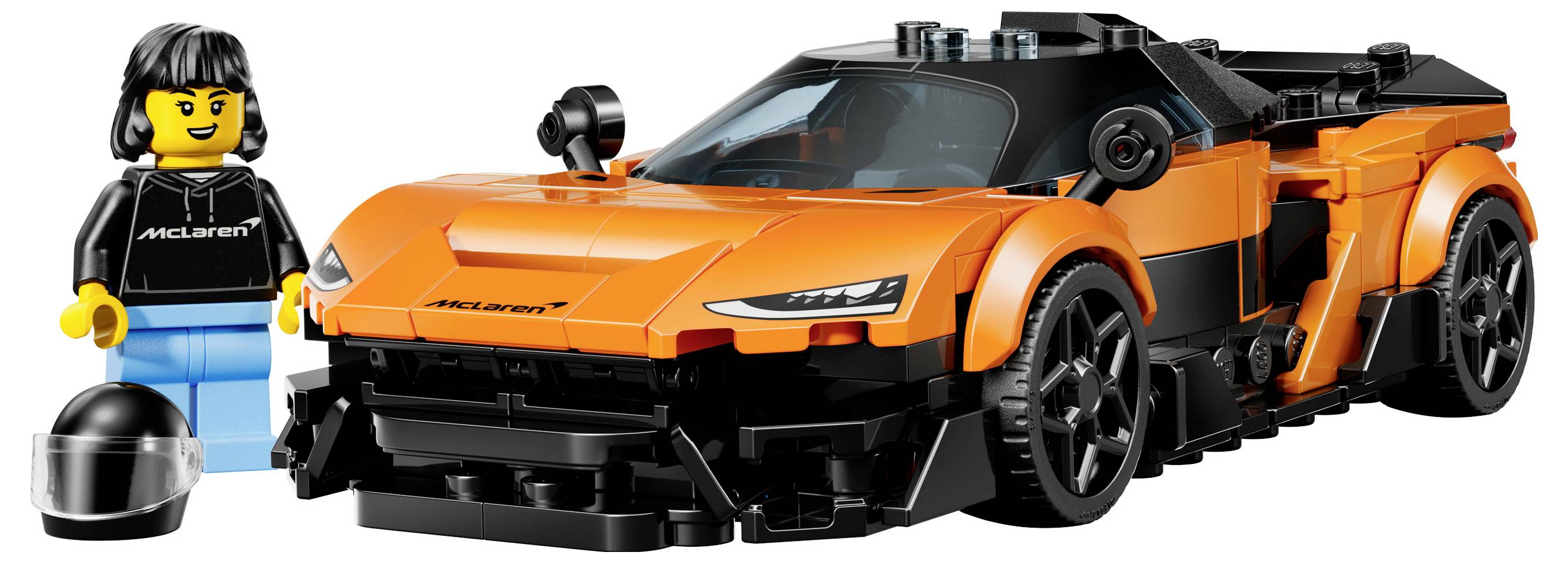 A toy building set with an orange sports car and a figure in a black outfit, holding a black helmet, both resembling a racing theme.