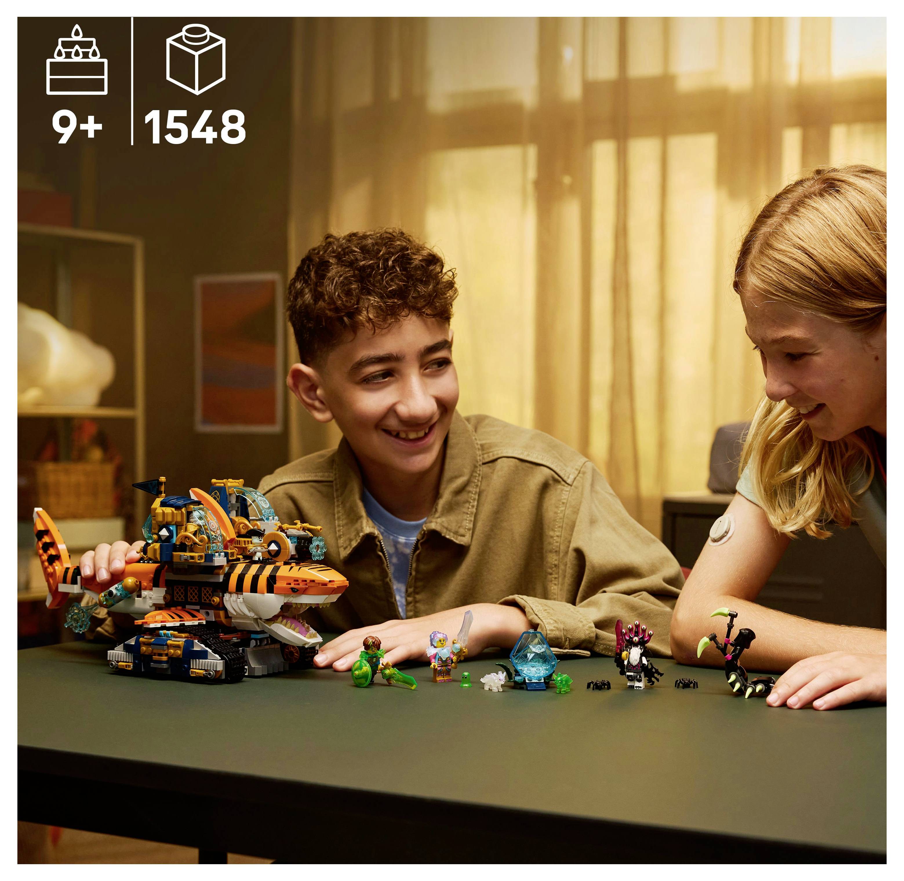 Two children play with a LEGO shark-themed vehicle set, showing creativity and concentration in a cozy room.