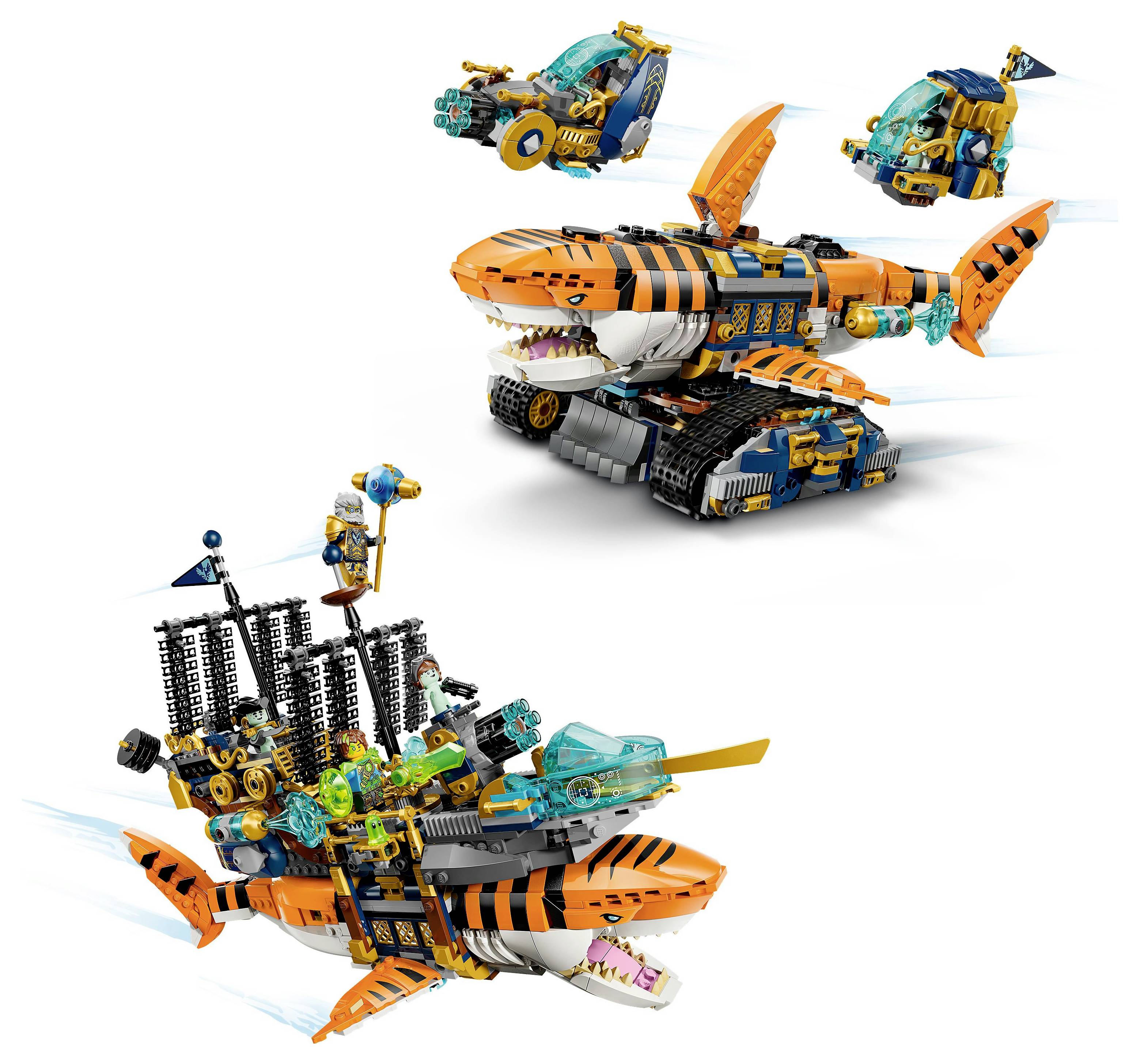 Toy models resembling a shark and submarine, combined with smaller sea-themed vehicles, featuring colorful designs and movable parts.