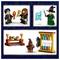 Lego figures of two characters in a dining scene with a table set with food and drinks, and a wizard casting a spell alongside potion bottles.