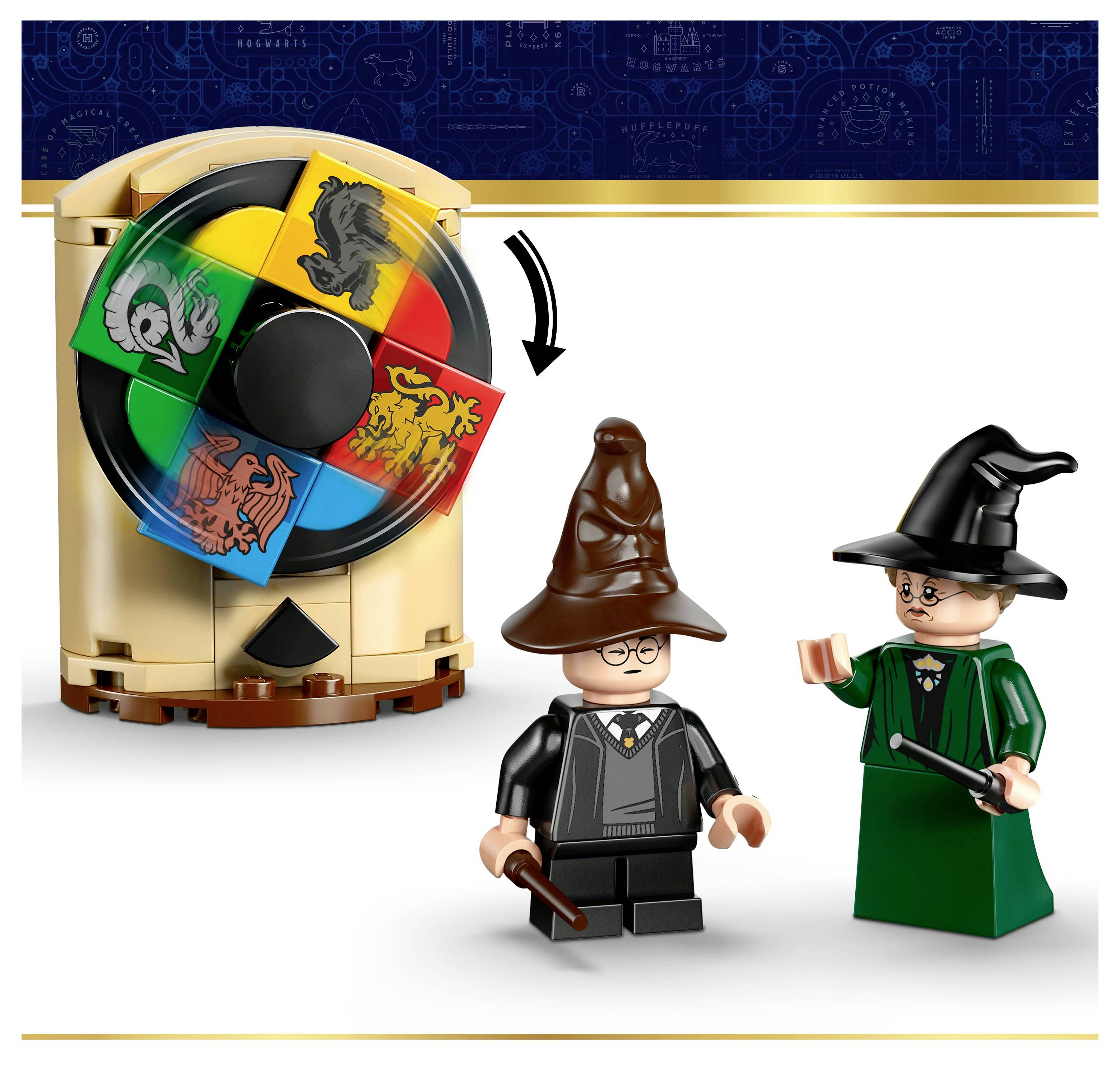 Two LEGO figures with wizard hats stand beside a spinning wheel featuring the four Hogwarts house crests.