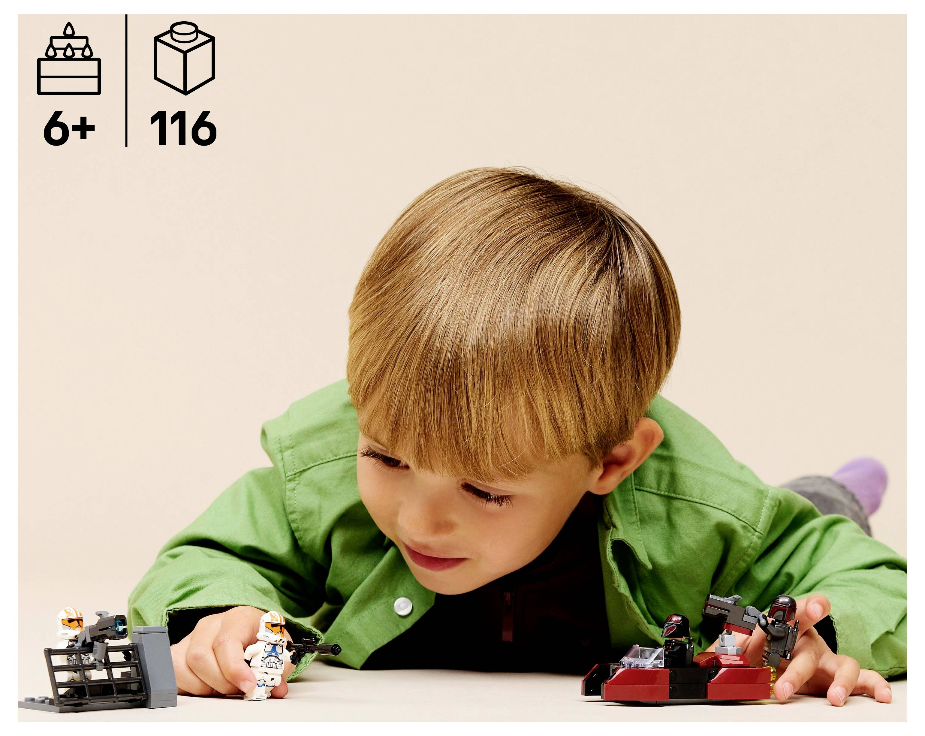 A child in a green shirt plays with toy figures and vehicles on the floor. The image suggests the toys are suitable for ages 6 and up with 116 pieces.