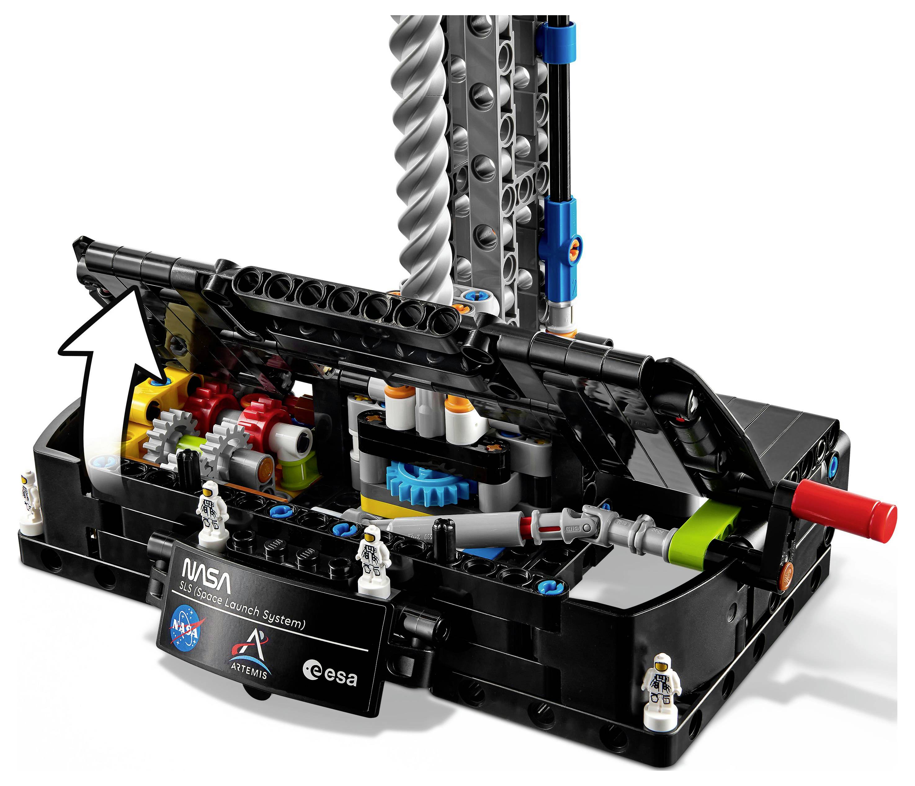 A LEGO model featuring NASA's Artemis rocket launch system with gears, pipes, and control panel elements, showcasing technical detail.